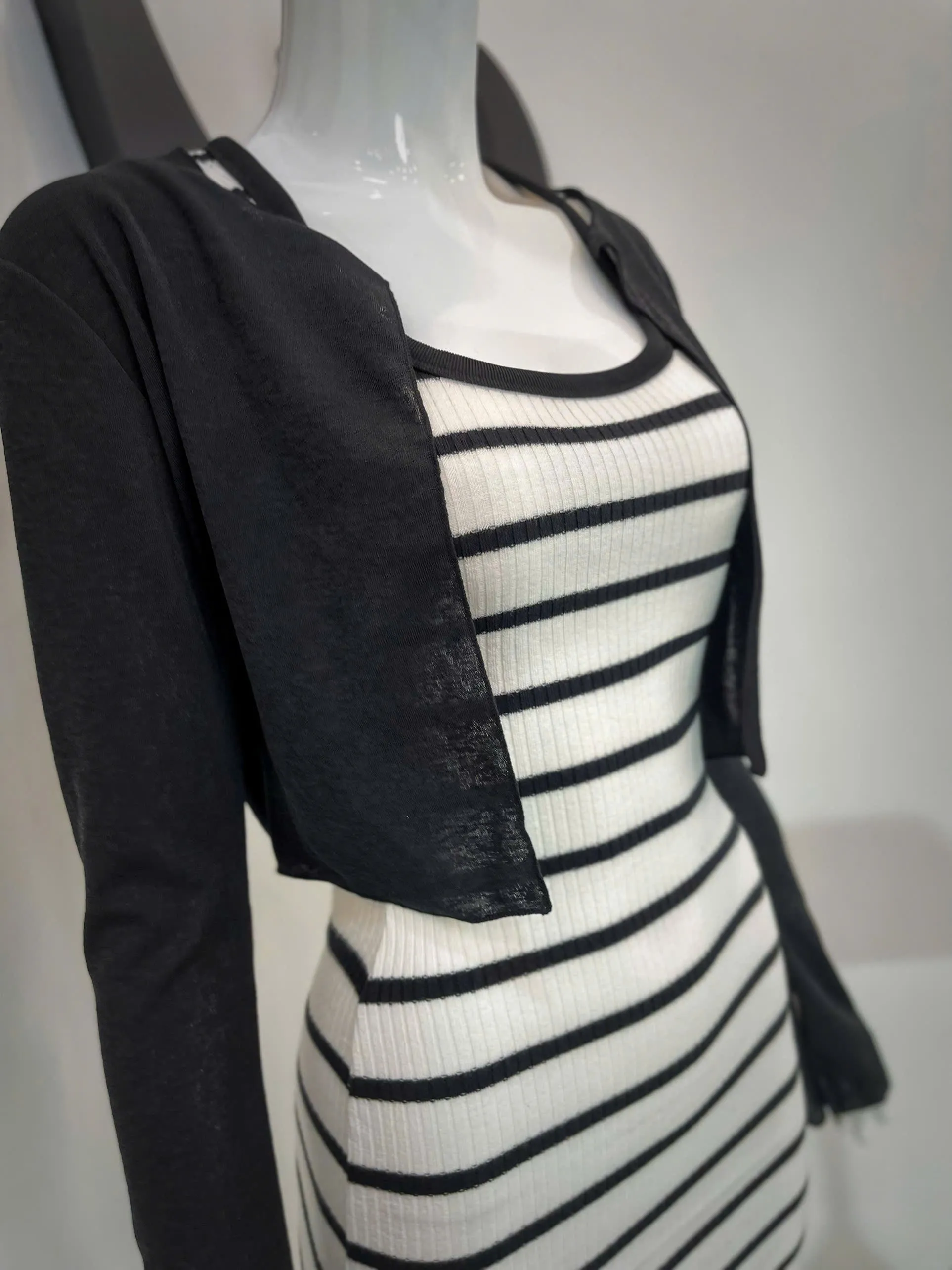 Set of black and white striped bodycon dress and black long-sleeved cardigan